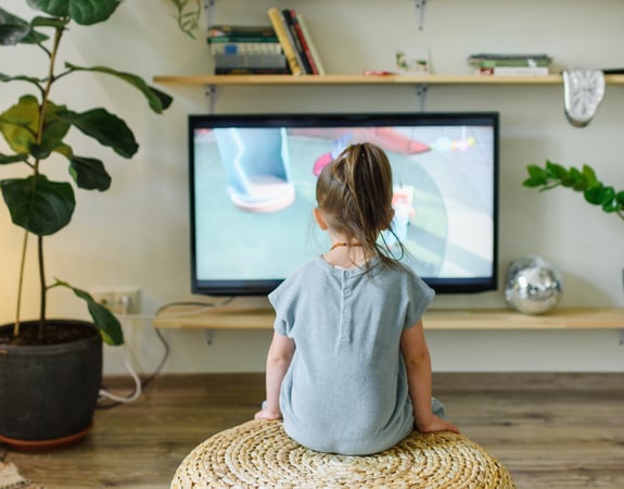 Child watching Disney+ streaming service